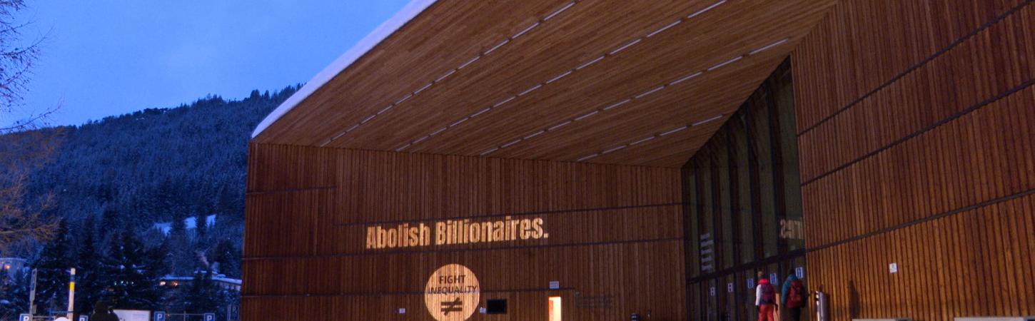 Davos Conference Center Displays Activist's Call to Abolish Billionaires 
